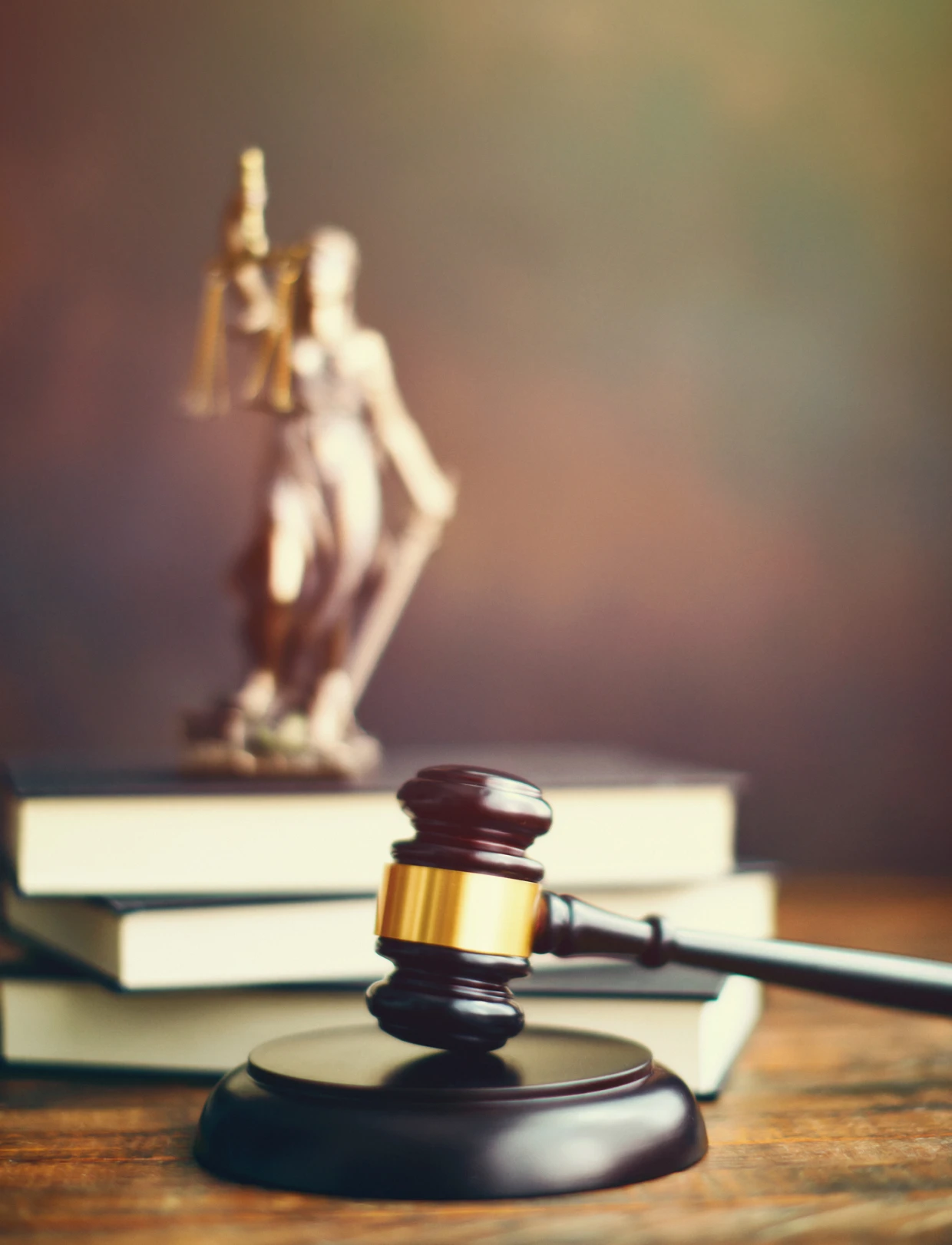 Legal gavel with justice statue