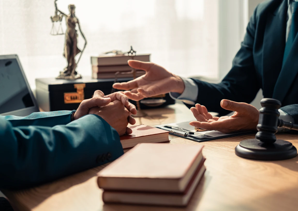 Lawyers discussing case at office desk
