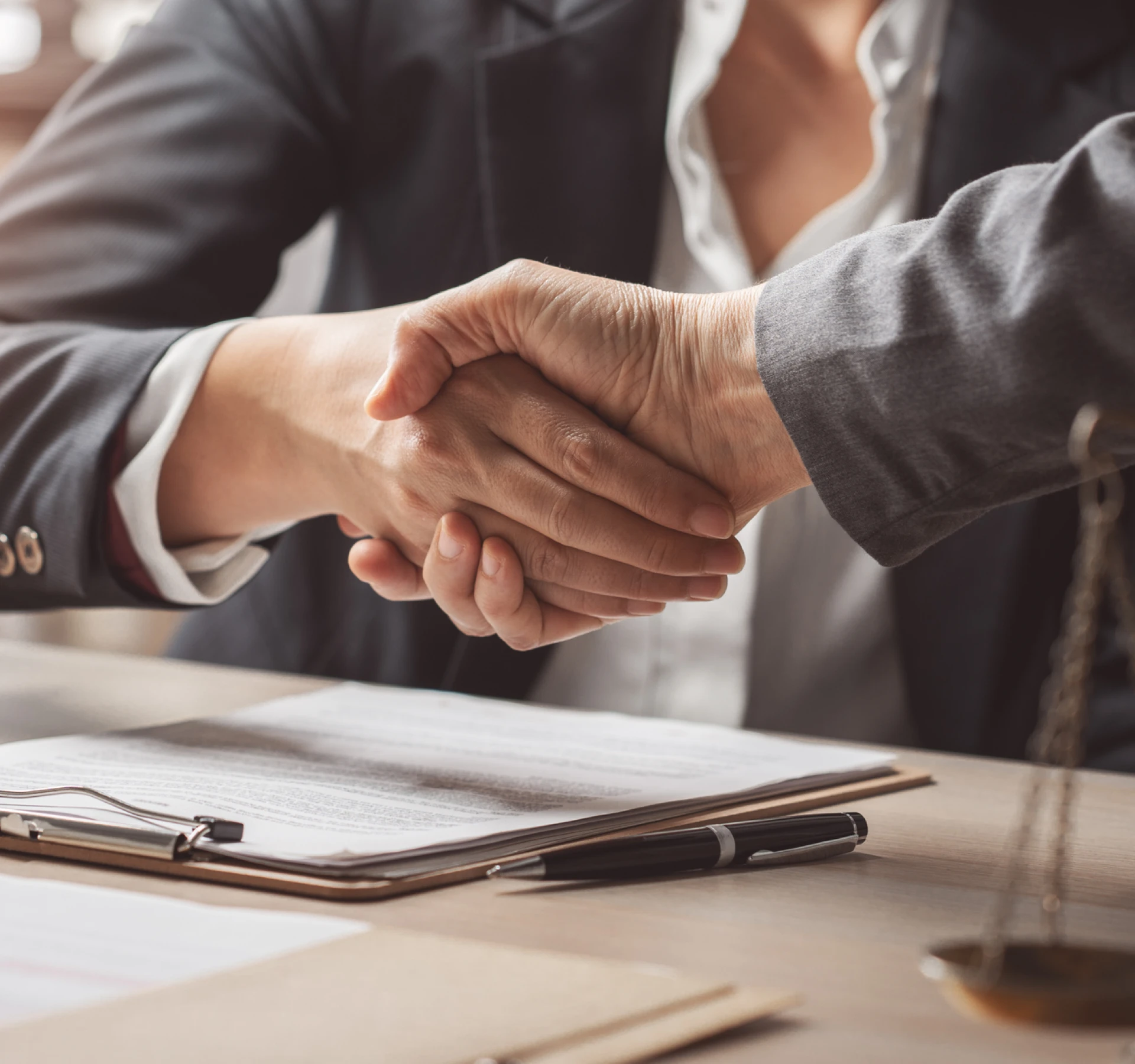 Professional handshake at a meeting table